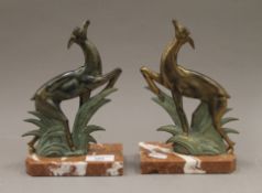 A pair of Art Deco models of deer. Each 20.5 cm high.