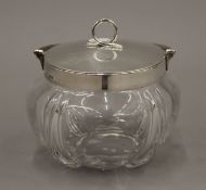 A silver mounted glass biscuit barrel. 13 cm wide.