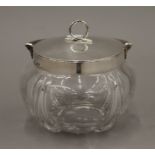 A silver mounted glass biscuit barrel. 13 cm wide.