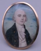 An 18th century unmarked gold framed miniature portrait on ivory of a young gentleman. 6 cm high.