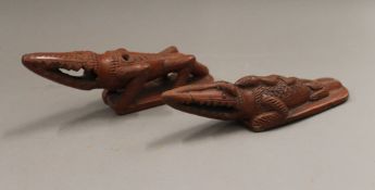 Two antique Turkish pottery bath rasps, each formed as a crocodile. The largest 19 cm long.