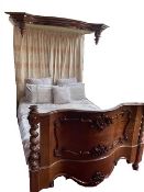 A Victorian mahogany half tester bed. Fabric not included. 196 cm wide.