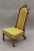 A Victorian walnut barley twist nursing chair. 97.5 cm high.