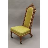 A Victorian walnut barley twist nursing chair. 97.5 cm high.