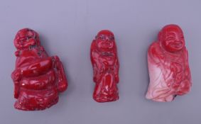 Three carved coral figures. The largest 5.5 cm high.