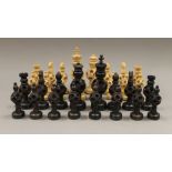 A Chinese/Indian carved wooden chess set.