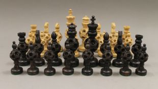 A Chinese/Indian carved wooden chess set.