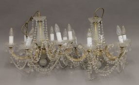 A pair of cut glass chandeliers. Each approximately 40 cm high.