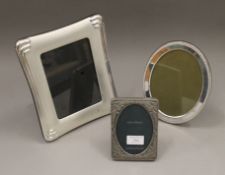 Three silver plated photograph frames. The largest 20.5 cm wide.