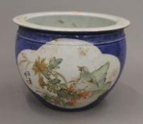 A Chinese blue porcelain jardiniere. 20 cm diameter.