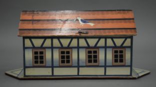 A painted wooden Noah's Ark with figures and animals. 33 cm long.