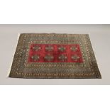 A small red ground rug. 134 cm x 94 cm.