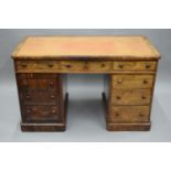 A 19th century rosewood desk, the top with drawers to one side and opposing dummy drawers,