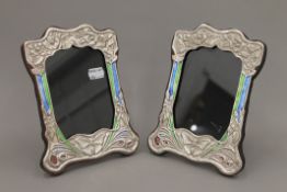 A pair of Art Nouveau style silver photograph frames. 21 cm high.