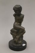 A bronze armless boy figure. 28 cm high.