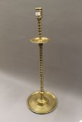 An antique Islamic bronze turned mosque candlestick. 82 cm high.