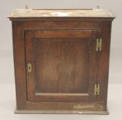 A Georgian oak panelled hanging cupboard. 75 cm wide.