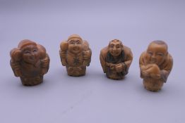 Four carved bone netsuke. Each approximately 4 cm high.