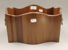 A small mahogany jardiniere. 32 cm wide.