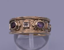 A gold diamond and multi-gem ring. Ring size N/O. 7 grammes total weight.