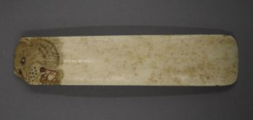 A 19th century Japanese carved bone shoehorn. 13.5 cm long.