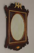 A Victorian inlaid and gilt heightened wall glass. 82.5 cm high.