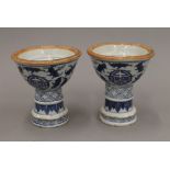 A pair of blue and white porcelain candlesticks. 11 cm high.