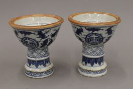 A pair of blue and white porcelain candlesticks. 11 cm high.