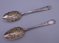 Two embossed silver berry spoons. 21 cm long. 116.3 grammes.