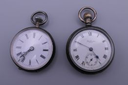 A silver Waltham USA pocket watch and another silver pocket watch. The former 3.5 cm diameter.