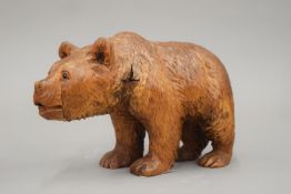 A Black Forest carved wooden bear. 21.5 cm long.