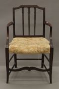 A 19th century mahogany open armchair. 54 cm wide.