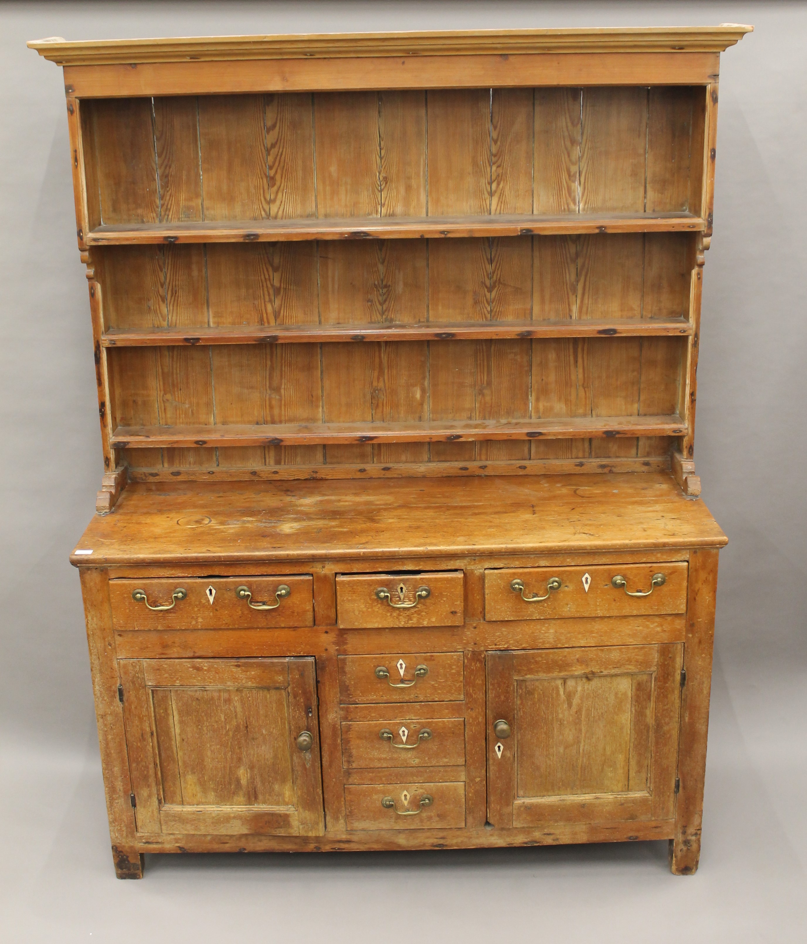 A Victorian pine dresser. 202.5 cm high x 162 cm wide.