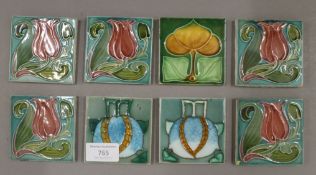 Eight small Art Nouveau tiles. 7.5 cm squared.