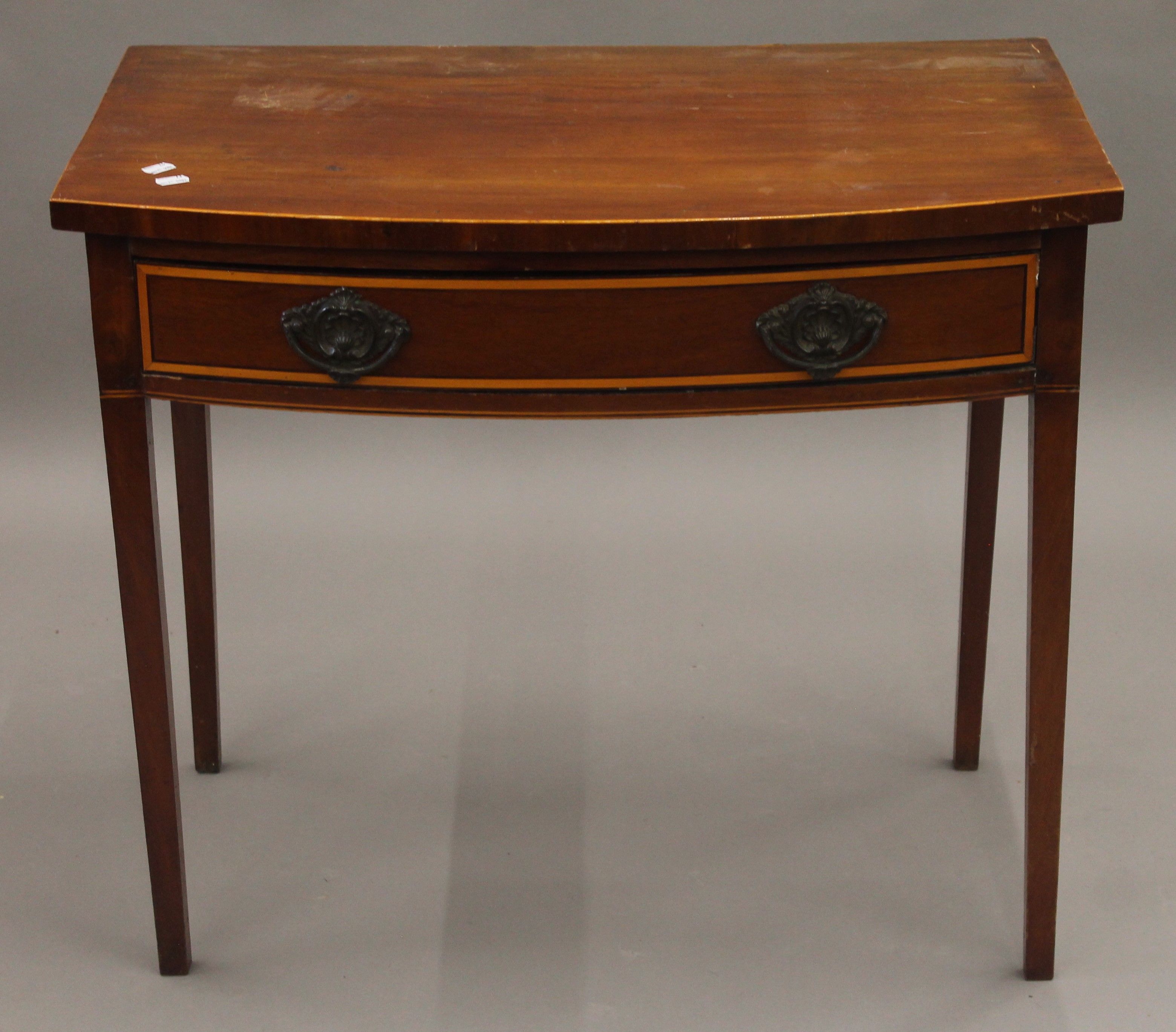 A 19th century mahogany bowfront single drawer side table. 81.5 cm wide.