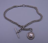 A silver watch chain. Approximately 43 cm long. 84.6 grammes.