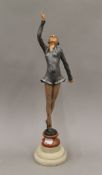 An Art Deco style painted figure of a dancing girl. 44 cm high.