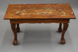 An Eastern bone and wooden inlaid hardwood coffee table. 91.5 cm long.