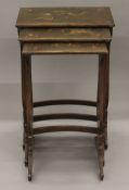 A late 19th/early 20th century chinoiserie lacquered nest of three tables. 47 cm wide.