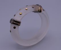 A silver mounted dress bangle. 8 cm exterior diameter.