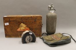A Soda Syphon, a box, a handbag and a pair of geode bookends.