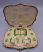 A set of silver and enamel buckles and buttons, stamped Goldsmiths and Silversmiths Company,