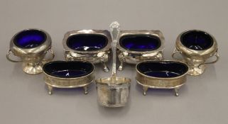 Three pairs of silver salts and a sifter spoon. 8 troy ounces.