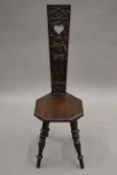 A Victorian carved oak spinners chair.
