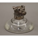 A Victorian silver mounted glass inkwell, the lid formed as a terrier's head. 11.5 cm high.