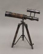 A small telescope on stand. 25.5 cm long.