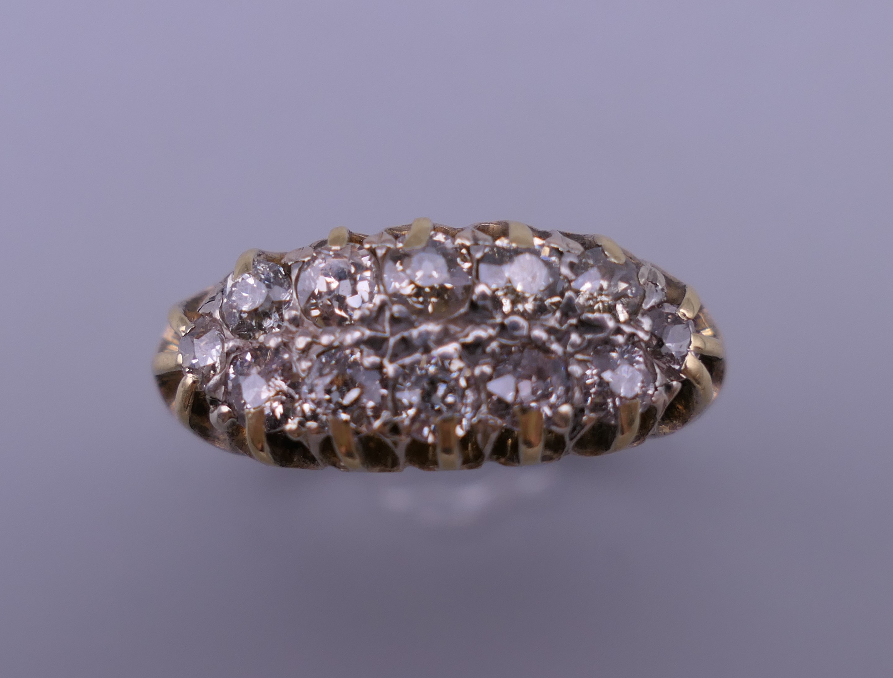 An 18 ct gold and diamond ring. Ring size O/P. 6 grammes total weight.