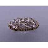 An 18 ct gold and diamond ring. Ring size O/P. 6 grammes total weight.