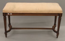 A late 19th/early 20th century French upholstered window seat. 92.5 cm long.