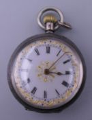 A Victorian silver fob watch.